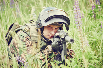Military soldier with assault rifle
