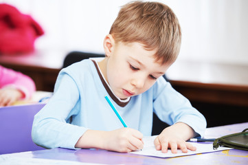 child boy studying writing
