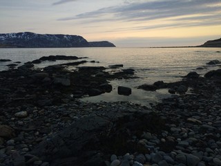 Dusk on the Beach over the Ocean Cliffs