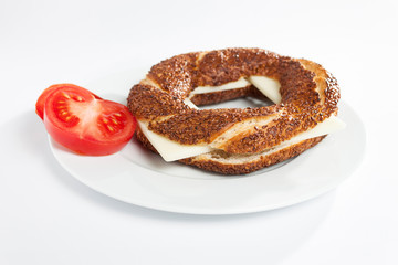 Simit (Turkish bagel) on white plate