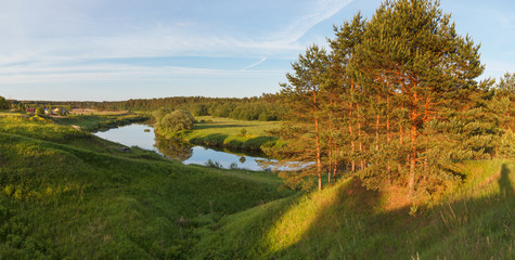 Summer panoramic landscape with the river on in the evening sun © Igor Gorshkov