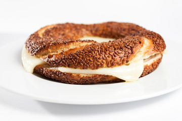 Simit (Turkish bagel) on white plate