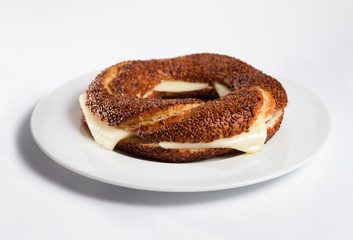 Simit (Turkish bagel) on white plate