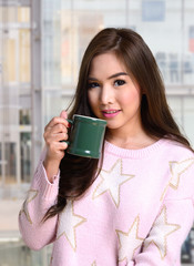 Pretty girl with hot coffee.