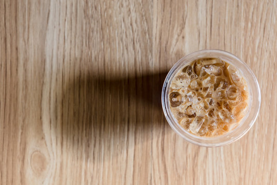 Ice Coffee Topview On Wood Background Long Shadow