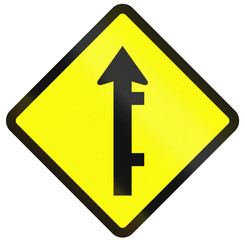 Indonesian road warning sign: Offset roads intersection ahead