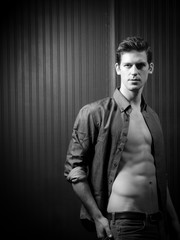 Confident Athletic Man In Unbuttoned Shirt