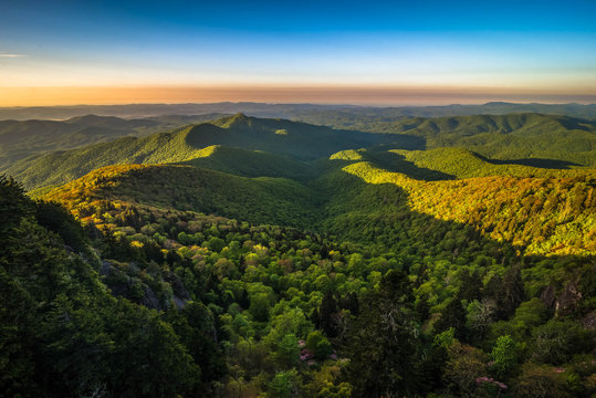 The colorful sunrise of the ancient Blue Ridge Mountains taken during the spring blooms along the scenic Blue Ridge Parkway in North Carolina
