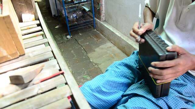 Burmese people carving Lacquerware