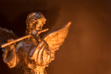 Winged Angel Playing Flute