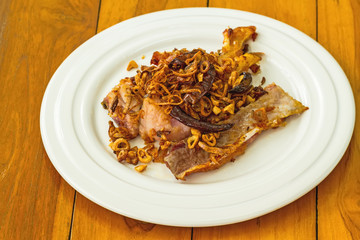 fried pickled fish food in white dish on wooden