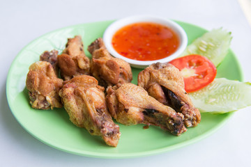 deep fried chicken wing with spicy sauce