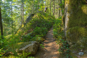 Obraz premium Hiker Climbs Granite Boulders