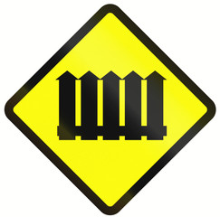 Indonesian warning road sign - Barrier level crossing