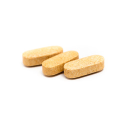 Tablet pills on white background.