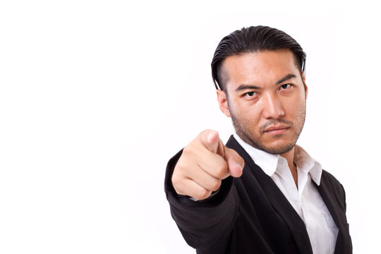 serious businessman pointing at you