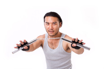 Fototapeta na wymiar asian Kung Fu man with chainsticks or nunchaku