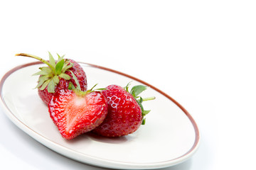 Strawberry with leaf on white background