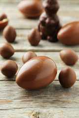 Chocolate easter eggs on grey wooden background