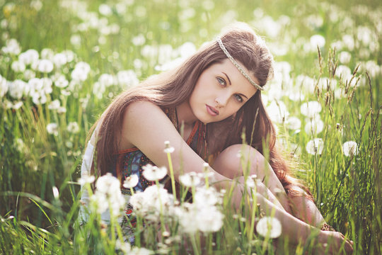 Beautiful free girl in a flower meadow