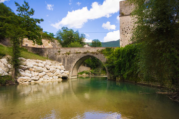 Fototapeta na wymiar Ponte romano sul fiume Sentino a San Vittore delle Chiuse