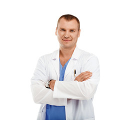 Fototapeta premium Portrait of a young male doctor in a white coat and blue scrubs