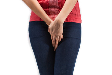 Close up of a woman with hands holding her crotch isolated in a