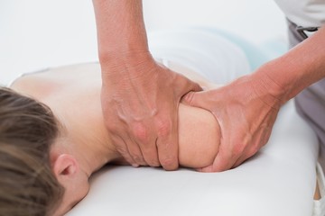 Fototapeta na wymiar Physiotherapist doing arm massage to his patient