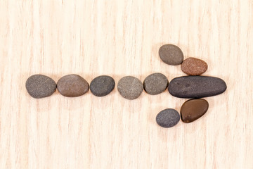 Fototapeta na wymiar left arrow lined with sea pebbles