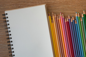 Obraz premium color pencils with notebook