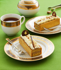 Cake of banana muffins and banana cream covered with butter cream.