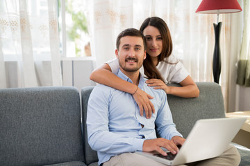 Loving couple with a laptop