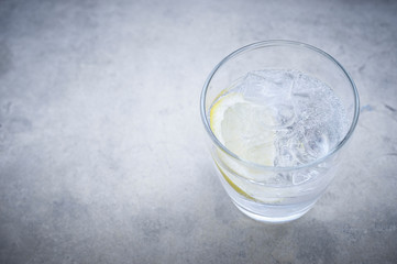 Gin and tonic cocktail with lemon