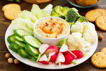 homemade hummus with raw vegetables.