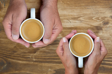 Concept of male and female hands, love and coffee