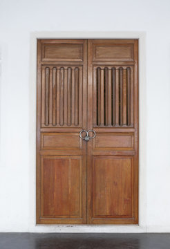 Closed old door in Chinese style on white background