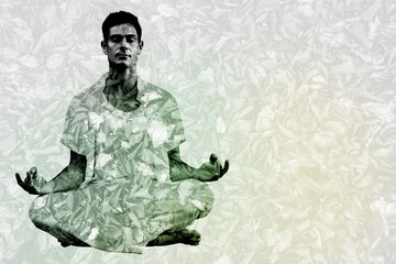 Fototapeta na wymiar Handsome man in white meditating in lotus pose