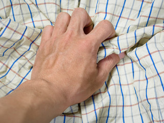 hand touching fabric