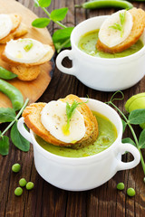 Green pea soup with croutons and cheese.