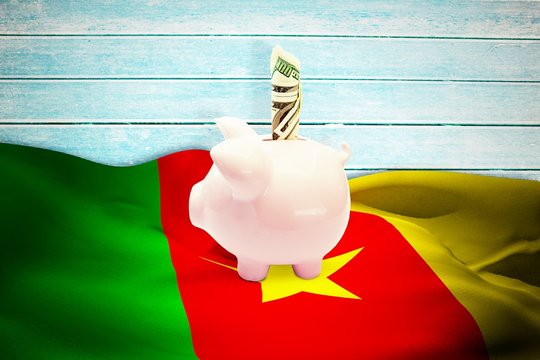 Composite image of dollar in piggy bank