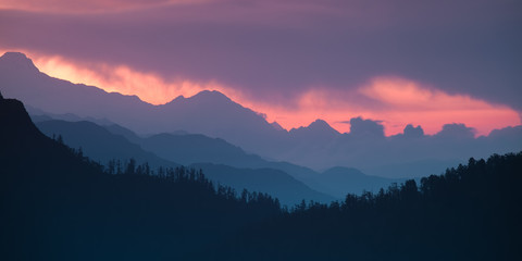 Panoramic Himalayan hills and mountains topped with a colorful dramatic sky. - 85806923