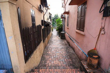 Fototapeta na wymiar Small brick passage in Luang Pra Bang,Laos