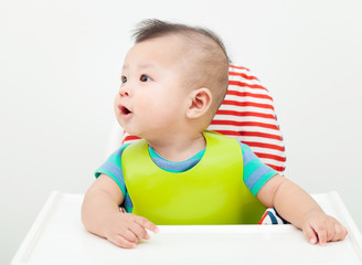 happy baby child sitting in chair