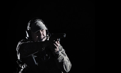 Man aiming with gun in battlefield