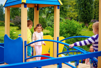 Obraz premium group of happy kids having fun on playground
