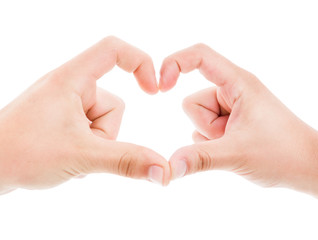 Couple making heart shape with fingers
