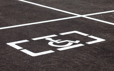 Parking places with handicapped or disabled signs and marking li
