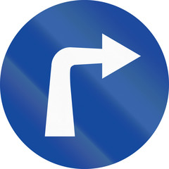 Greek traffic sign: Turn right ahead