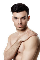 Healthy muscular young man. Isolated on white background