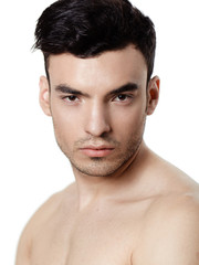 Obraz premium Charming and handsome man face over a white background